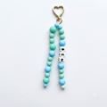 Beaded keychain with heart-shaped clasp and 'BEN' tag on a white background